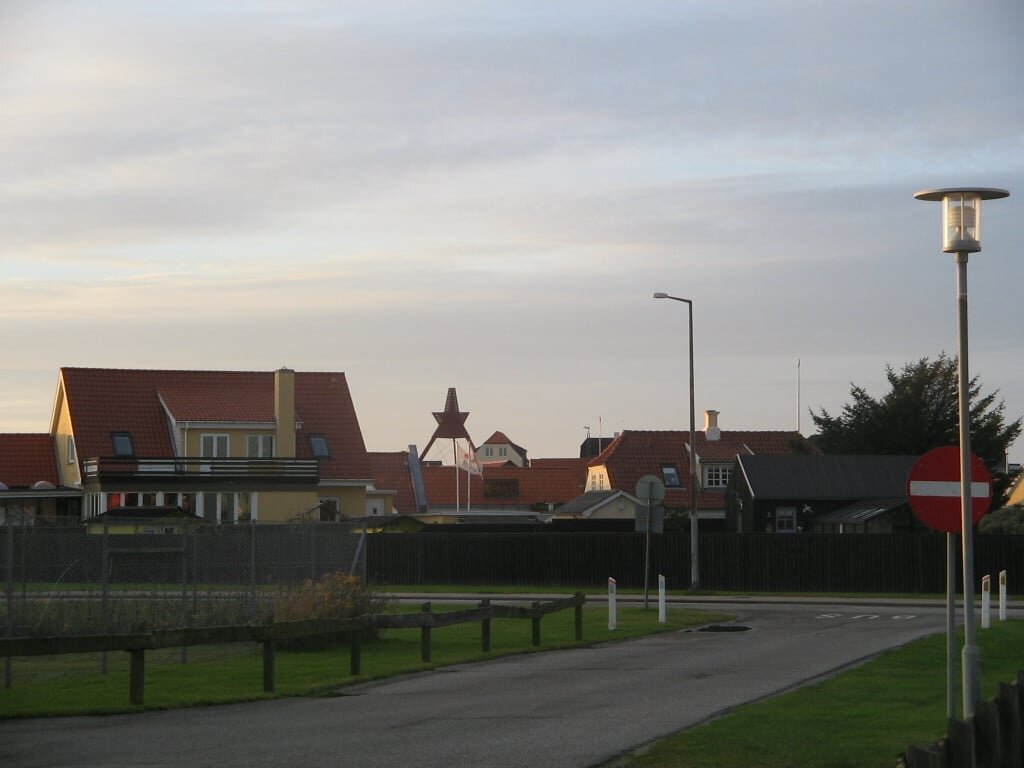 Colorful beach huts and town promenade in Løkken