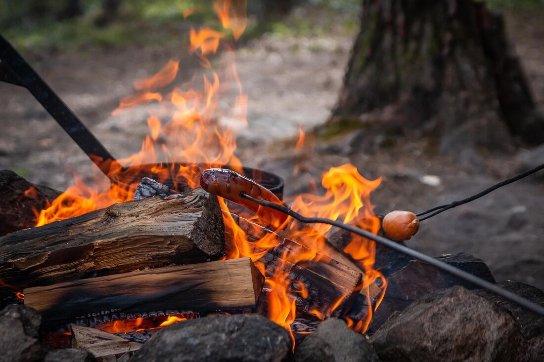 Families around a campfire at dusk