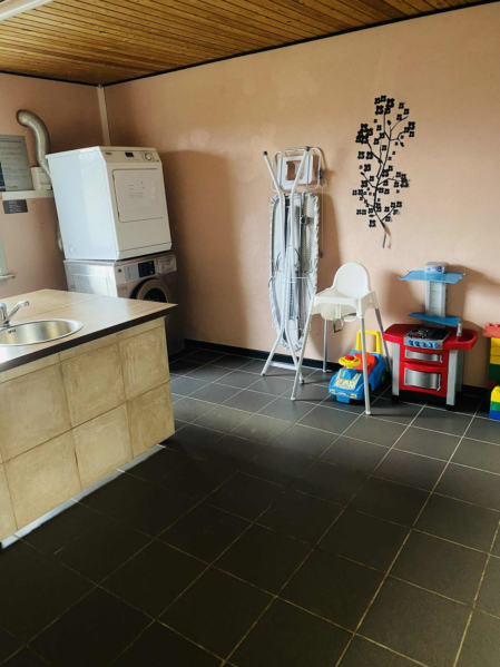 Laundry room with modern washing machines and dryers